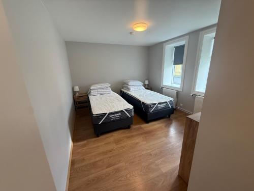 Llit o llits en una habitació de Lárubúð