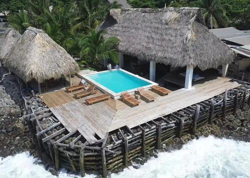 an aerial view of a resort with a swimming pool at Punta El Zonte in El Zonte