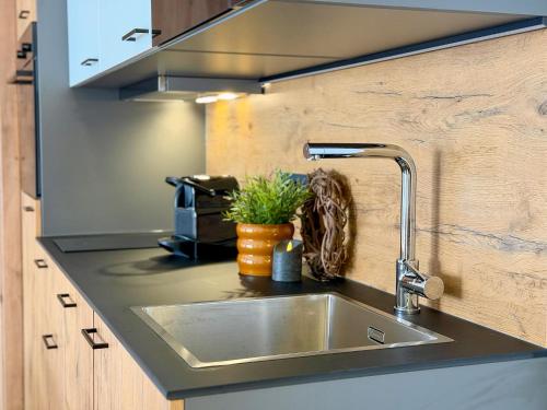 a kitchen counter with a sink in a kitchen at Bockblick Top 5 in Weisspriach