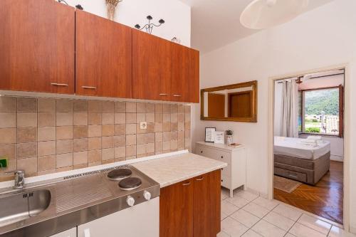 a kitchen with a sink and a counter top at Apartments and rooms by the sea Slano, Dubrovnik - 2687 in Slano