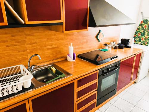 a kitchen with a sink and a stove top oven at GaribaldiCentrePort in Ancona