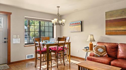 a living room with a table and chairs and a couch at The Buckeye in Red Lodge