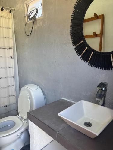 a bathroom with a sink and a mirror on the wall at Los Romanos farm in Sauce Bajada