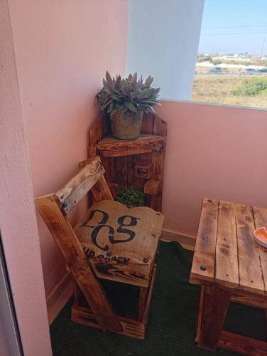 a room with a table and a chair and a window at الصخيرات in Skhirat