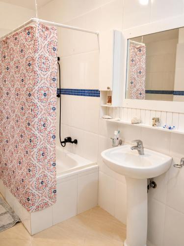 a bathroom with a sink and a shower curtain at Comfort Room 3 Adults Only in La Laguna