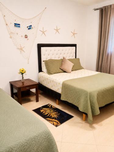 a bedroom with two beds and a table at Comfort Room 3 Adults Only in La Laguna