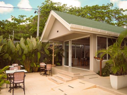 a patio with chairs and tables and a building at The Providence Hotel Boutique - Adults Only in San Andrés
