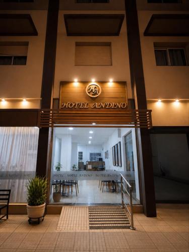a hotel entrance with tables and chairs in a building at Hotel Andino in La Rioja