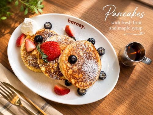 a plate of pancakes with fresh fruit andmagic syrup at HOMA Chalong Bay in Ban Klang
