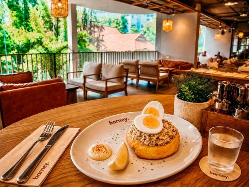 a white plate with a pastry on a table at HOMA Chalong Bay in Ban Klang