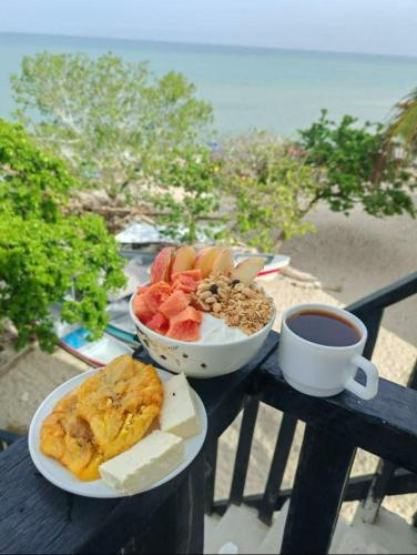 a table with two plates of food and a cup of coffee at La Casa de la Tortuga in San Onofre