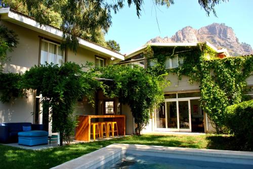 a house with a swimming pool in the yard at Skyview Manor in Stellenbosch