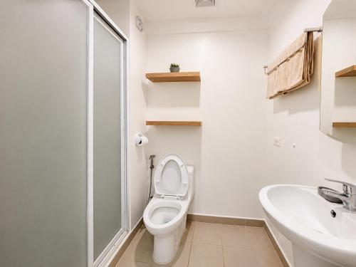 a white bathroom with a toilet and a sink at Cozy Condo at Avida Tower 4, IT Park Cebu in Cebu City
