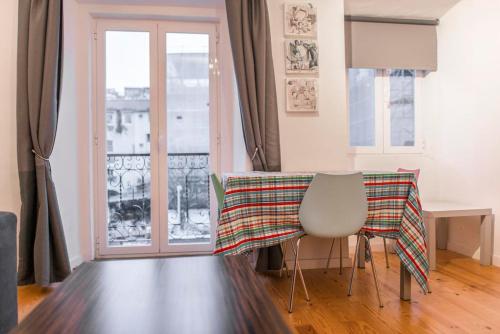 a table with a table cloth on it in a room at Apartamento Mártires da Pátria in Lisbon