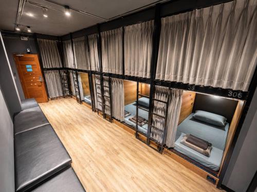 a room with a bunch of bunk beds at BANKBED Hostel in Bangkok