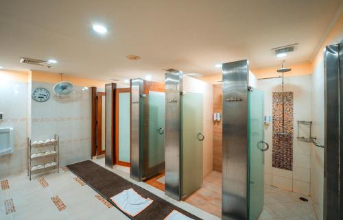 a bathroom with a row of elevators in a building at The Emerald Hotel Bangkok Ratchada in Bangkok