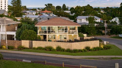 a house on the side of a road at Absolute Beachfront Escape Family Retreat in Mandurah
