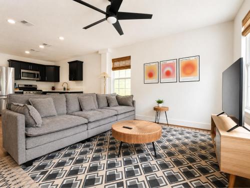 a living room with a couch and a table at Houston House - Free Parking in Houston
