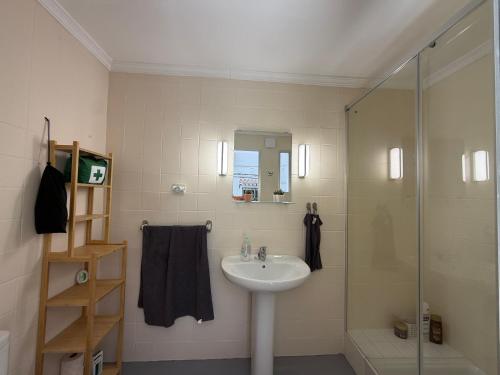 a bathroom with a sink and a shower at Casa Hjort in Nerja