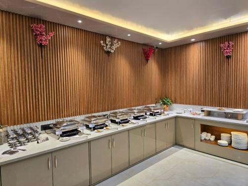 a kitchen with a counter with a stove top at KAMNA HILL RESORT a Boutique cottages in Shimla