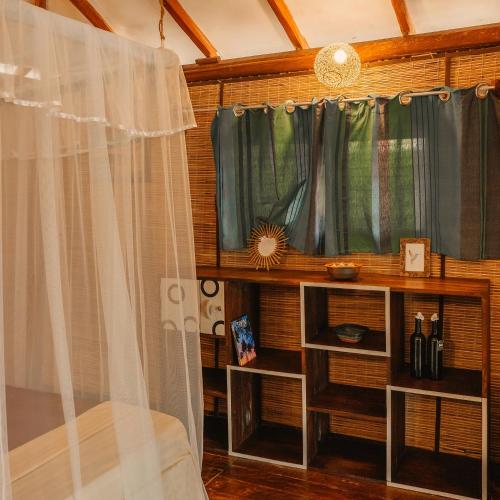 a room with a window and a curtain at Kitesurfing Lanka in Kalpitiya