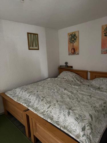 a bed in a bedroom with a bed frame at Ferienwohnung & Monteurwohnung Oberburg in Solingen