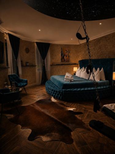 a bedroom with a swing bed and a star ceiling at Zámoček Mraznica in Prievidza