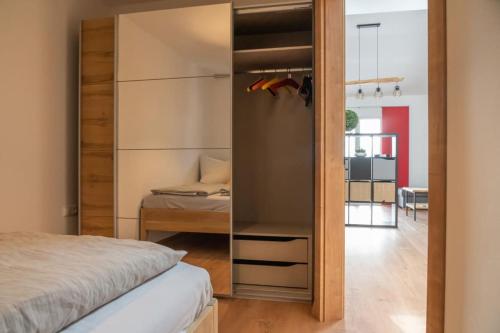 a bedroom with a bed and a sliding glass door at Ferienwohnung Döller in Gmünd