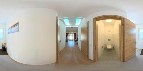 a hallway in a building with a large white wall at Ferienwohnung Döller in Gmünd