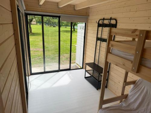 a view of the inside of a tiny house with a bunk bed at Teemeistri Camp in Tõrva