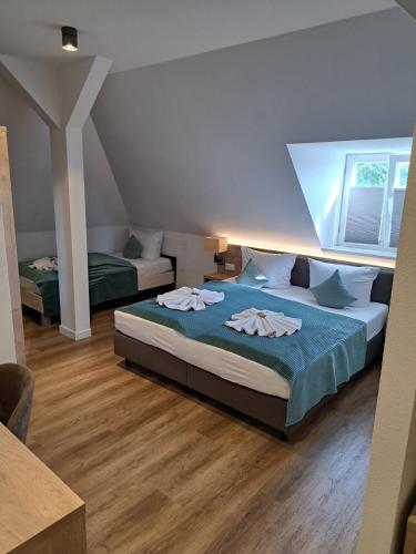 a bedroom with a bed with two towels on it at VillaWie in Rheda-Wiedenbrück