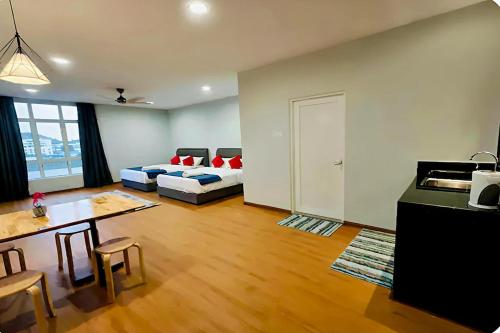 a living room with a couch and a table at KM Barakah Suite Kuala Terengganu in Kuala Terengganu