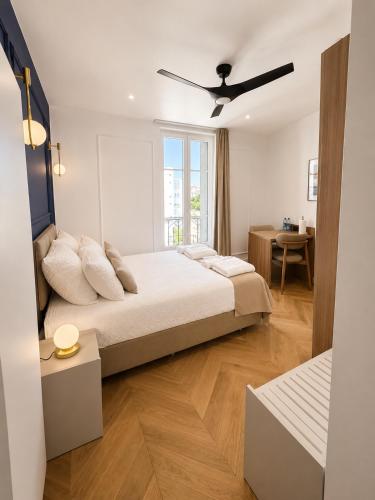 a bedroom with a large bed and a window at The Originals Residence, Les Sources Callou, Vichy in Vichy