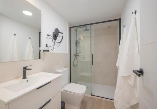 a bathroom with a toilet sink and a shower at Coliving Torremolinos Casa privada in Torremolinos