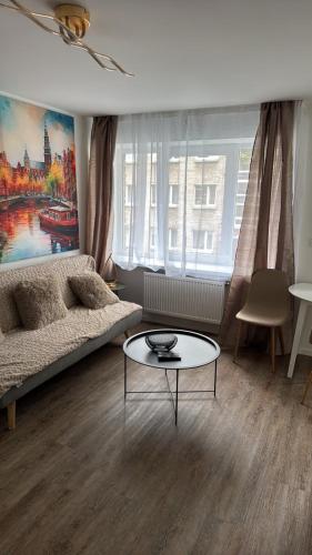 a living room with a couch and a coffee table at Amstel LUX in Narva