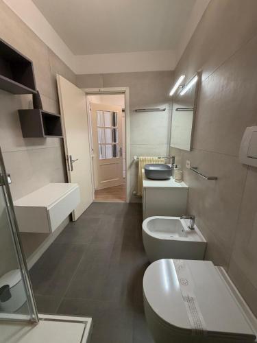 a small bathroom with a toilet and a sink at Sottocastello 1 in Gorizia