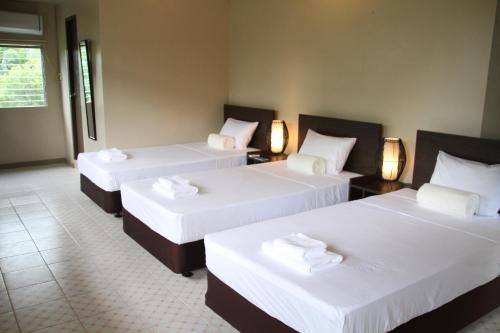 Кровать или кровати в номере DW Motel
