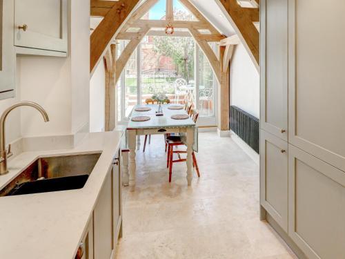 a kitchen with a table and a dining room at Bakers View in Winchester
