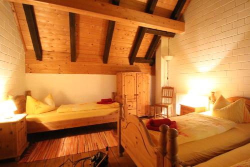 a bedroom with a bed and a desk in a room at Die Radler-Scheune in Burg