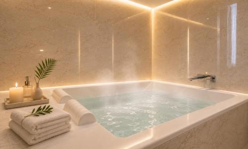 a bath tub in a bathroom with at Guwol Hotel in Incheon