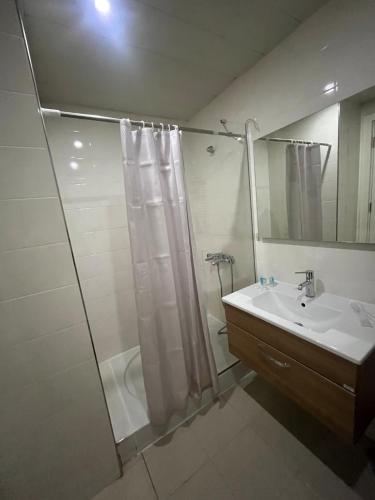 a bathroom with a shower and a sink at Apartment in green Budapest in Tbilisi City