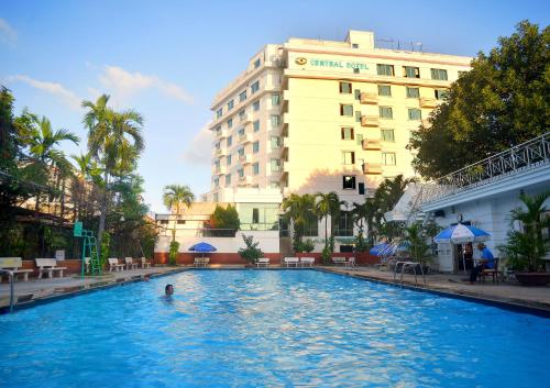 a swimming pool in front of a hotel at Central Hotel in Quảng Ngãi