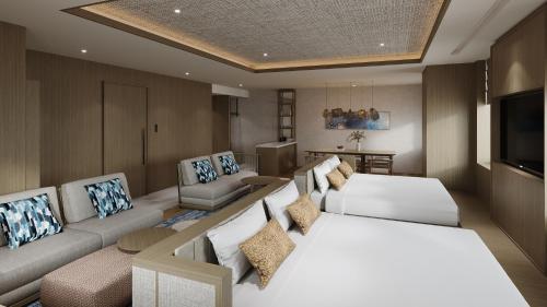 a living room with two beds and a couch at QUINTESSA HOTEL The Collection Osaka Bay in Osaka