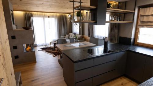 a kitchen with a large island in a room at Tlisöra Speckstube in Frena