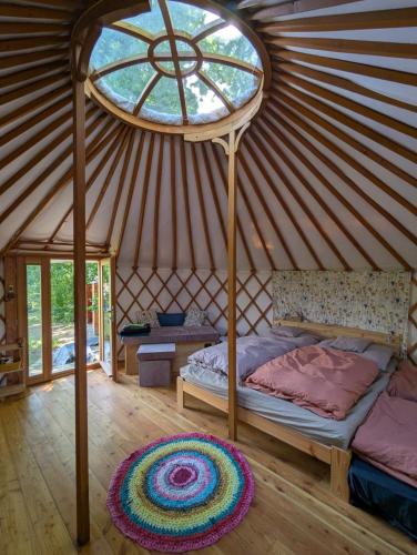 a bedroom with a bed in a yurt at Martinická jurta in Martinice u Dolních Kralovic