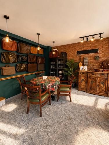 a dining room with a table and chairs at Chemodann Kazbegi in Kazbegi