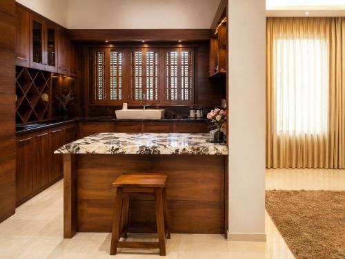 a kitchen with a large island with a counter top at Crescent Villa in Kalutara