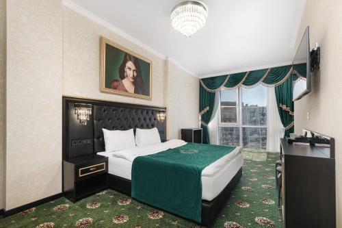 a hotel room with a bed and a window at Arcadia Sea Breeze in Odesa