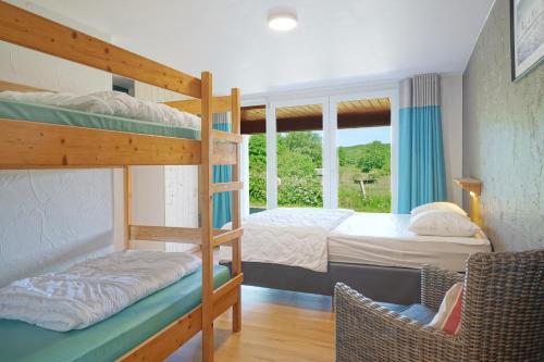 a bedroom with two bunk beds and a window at Le Milan Royal 26 pers, Malmedy, Balnéo, vue, calme in Malmedy