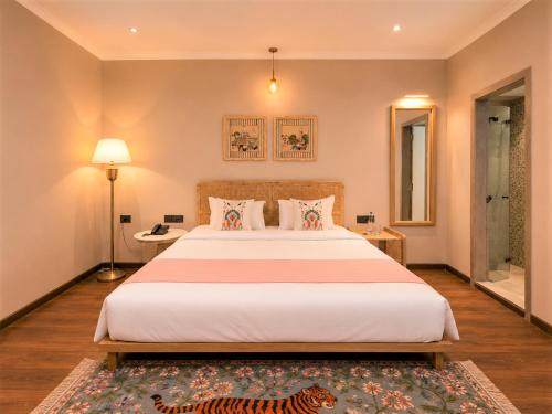 a bedroom with a large bed and a tiger rug at Chandralok - A Boutique Hotel in Udaipur Near Fateh Sagar Lake in Udaipur